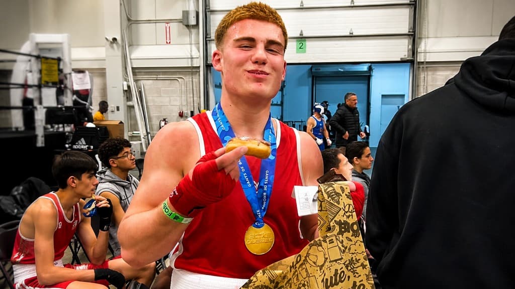 SBT amateur boxer celebrating with a medal at an amateur boxing competition