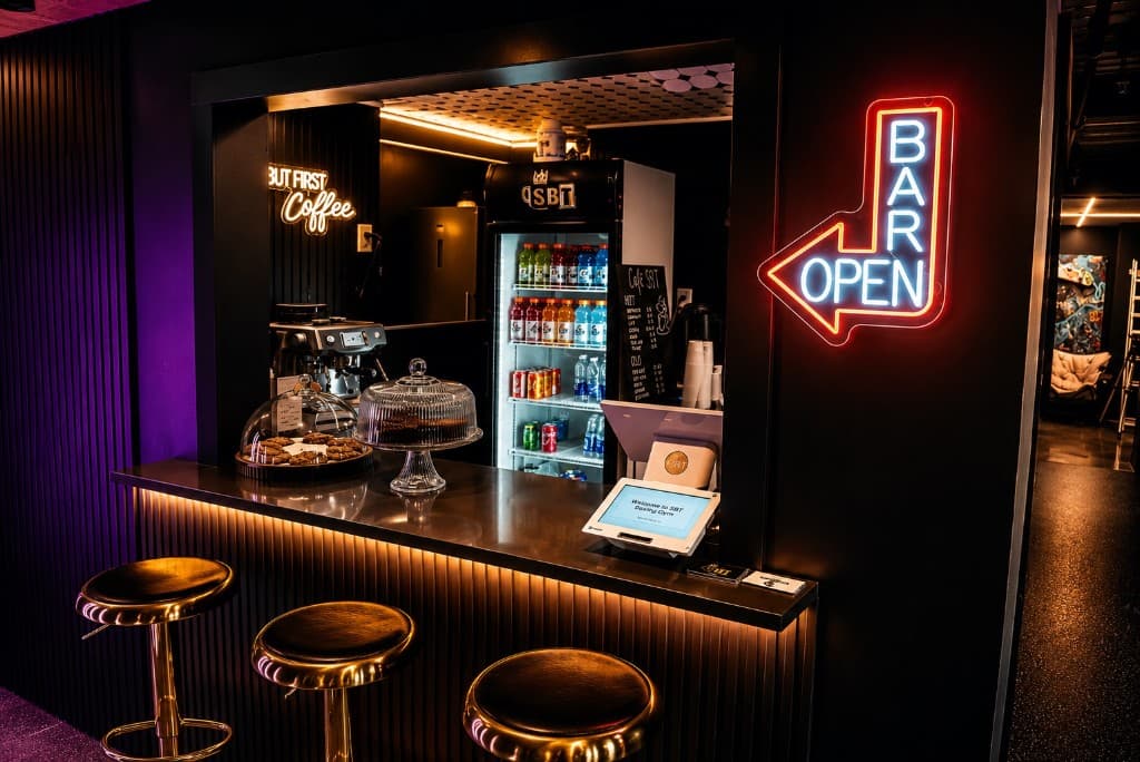 Café SBT bar with espresso, smoothies, and neon signage at SBT Boxing