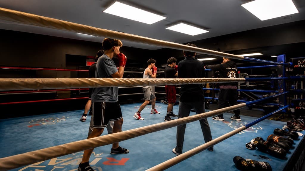 Boxers sparring in the ring during a training session at SBT Boxing